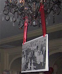 Enlarged Yearbook photo hanging from chandelier.