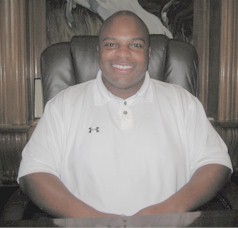 Mr. Eric Harris, East's new principal, at his desk