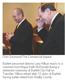 Bartlett personnel director Larry Hilbun reacts to a comment from Mayor Keith McDonald during a retirement ceremony.